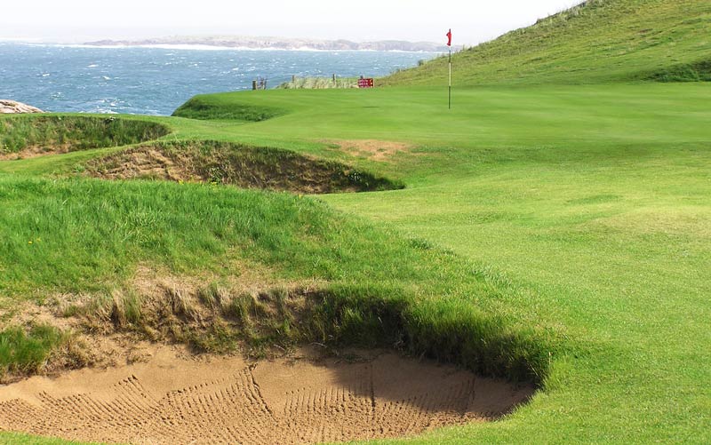 ... fifth greens hugging the coast at the nine hole Cruit Island, don't miss playing here!