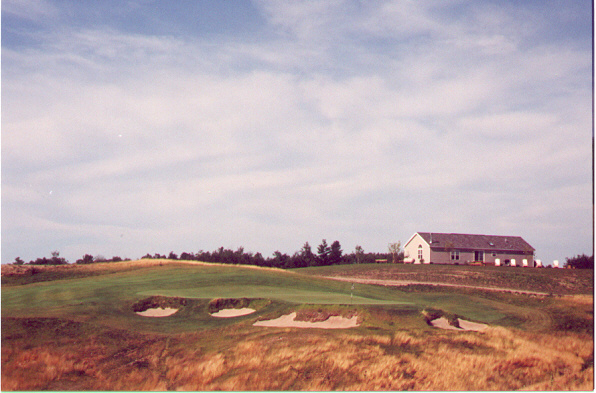 The 9th from the south tee, with the temporary clubhouse beyond the green.