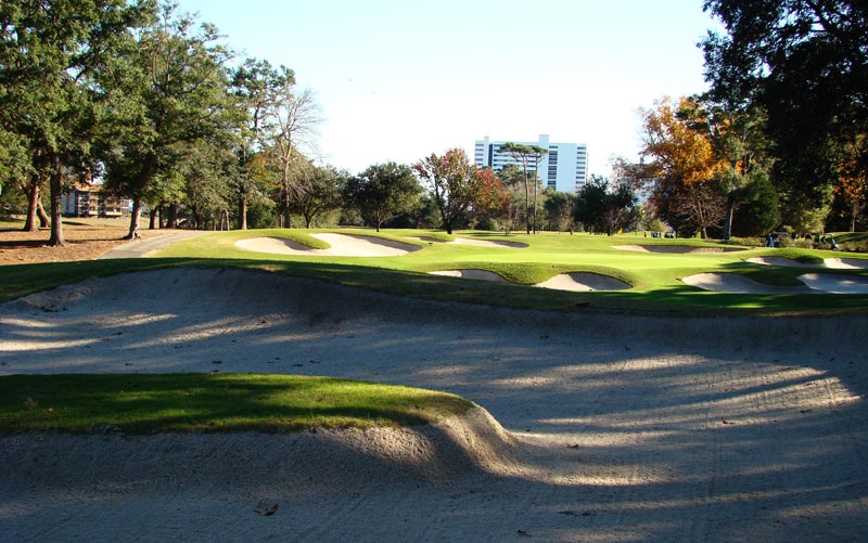 The sixteenth is a placement hole and this fairway bunker with its island needs to be avoided off the tee.