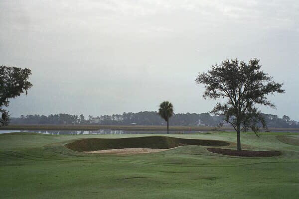 Though a reachable par five, the 16th green is heavily defended.