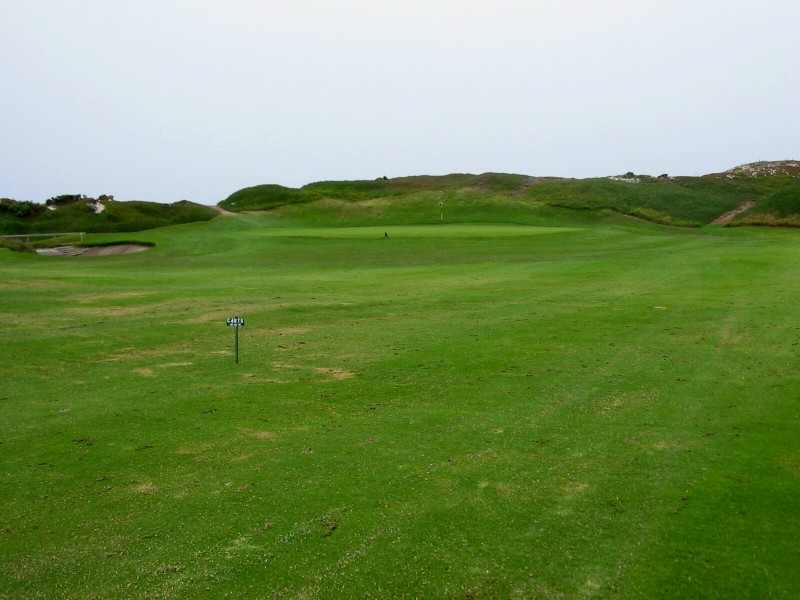The 11th green is set at the base of the dunes.