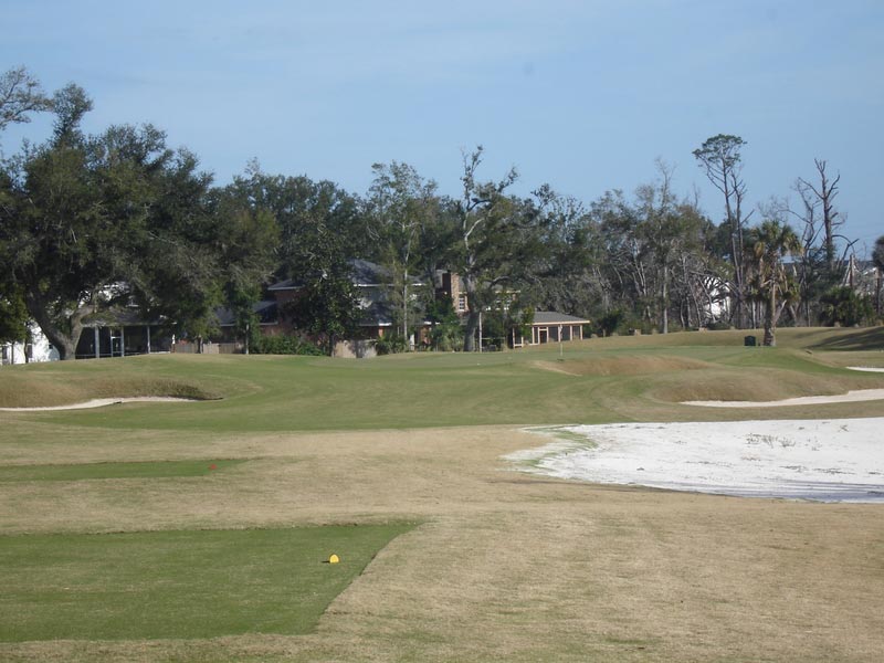 The seventh green â€œ the ball closest to the pin got there via the reverse Redan route, landing short left and kicking off the slope down toward the flag.