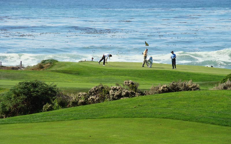 The majestic setting of the seventeenth green at Spanish Bay, as seen from the Inn.