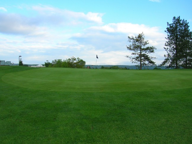 Shots not reaching the flag are liable to run off the extended false front of this horizon green.