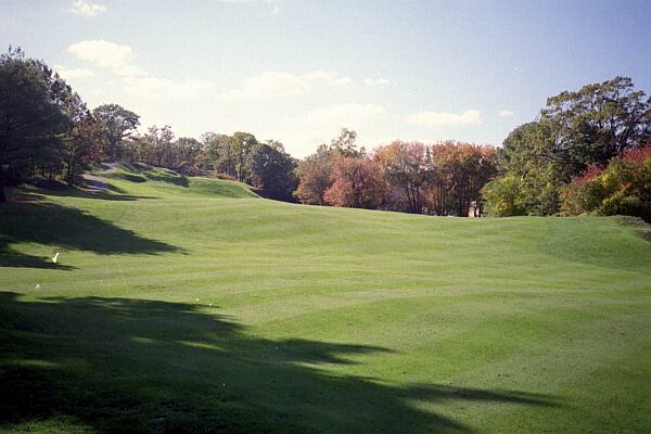 The green at the 12th is on top of the hill at the upper left of the picture.