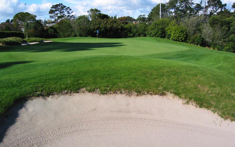 Simple bunker appearance at the left of the fifteenth green in contrast to the recently renovated hazards.