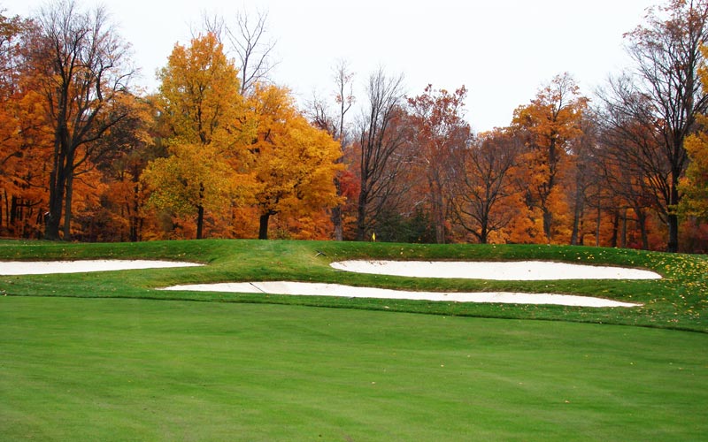 This bunker complex of three wide bunkers cut into a landform was restored in 2002. To see the putting surface, the golfer needs to either carry past it in two or lay up long down the left side of the fairway. Either way, there is much to accomplish on one's second shot, unusually for many par fives. 