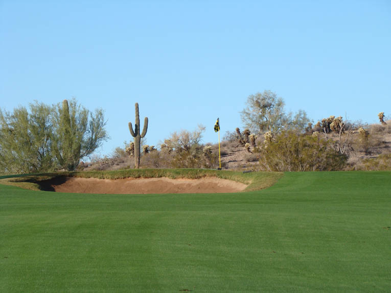 … leaving this unappealing pitch over a bunker to a putting surface that is out of sight.