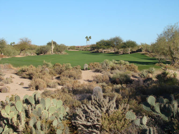 Though dauntingly long and narrow at one area, note how the fairway extends through the green (the bunker in the far distance is a right greenside one). Thus, even a 75 year old who hits it straight can feel good about the manner in which he is able to play the hole. Many other desert courses suffer from forced carries on holes of this length and thus tire a large percentage of golfers. Not here.