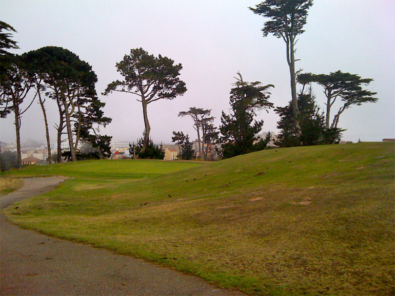 The huge mound in front of the 11th green can kick balls in any direction; it tends to accentuate whatever the golf ball is already doing, for better or worse. Anything left of this picture is big trouble.