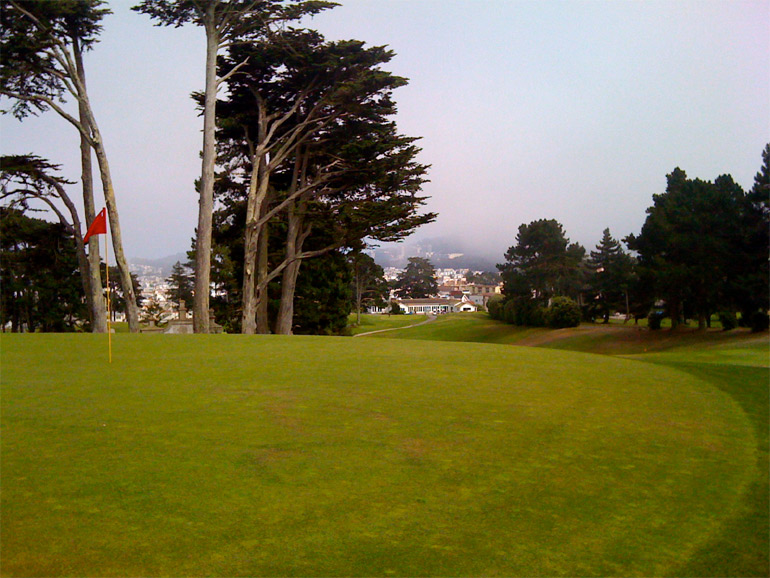 The uphill first hole, with the tee just to the right of the cart path in the distance. The ideal tee shot finishes closer to the right edge of this picture rather than on a straight line from tee to hole.
