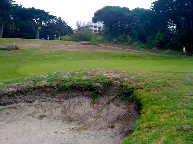 The green on the 4th hole, with the 5th tee up the hill in the background.