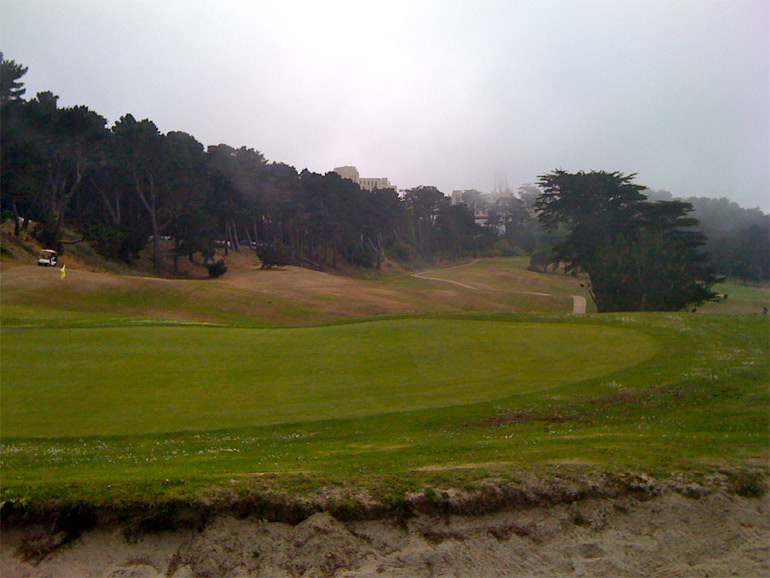 From behind the green, the cant of the 5th fairway is apparent. One can imagine how a downwind shot from the low left side of the fairway would be a great challenge - if the green were firm.