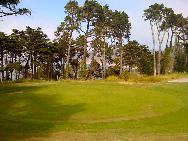 The 15th green from the left side, with Baker Beach in the background.