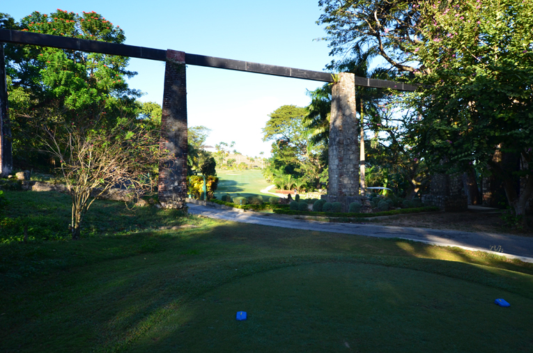 The tee ball from the back markers is played through the stone pillars of an aqueduct ....