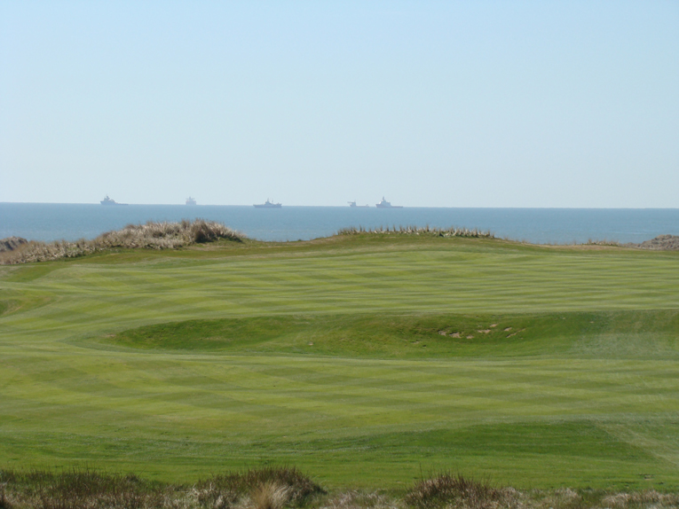 As seen from the tee, the ships remind one of Aberdeen's long distinguished history as a major port.