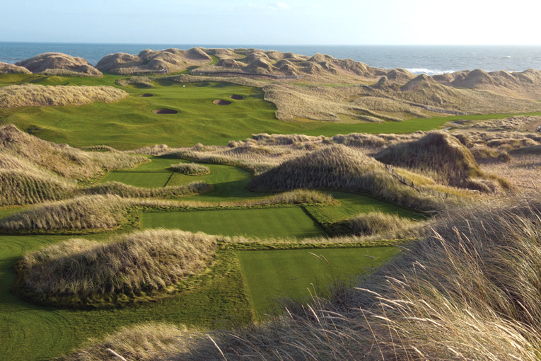 The vast spaciousness of both the dunes and the course is acutely felt from the thirteenth tee. Note how the marram grass was planted to stabilize the dune system.
