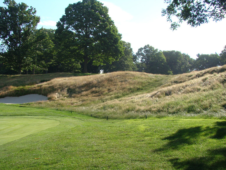 This fierce thirty foot rise falls 490 yards from the tee - getting past it in two shots is the object.