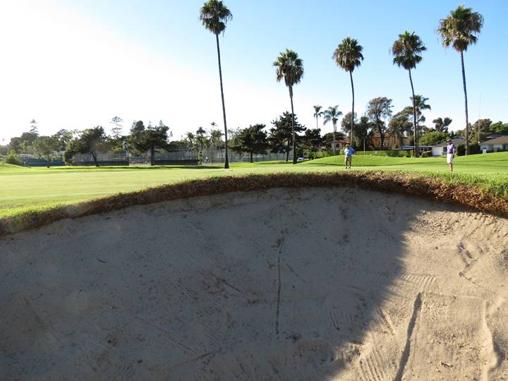 No 2-D bunkers here! This view from inside the greenside bunker at the fourteenth proves that these penal bunkers add to the strategic options of each hole. 