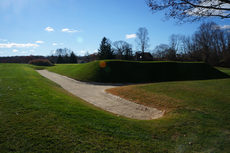 This view from back right of the green highlights Emmet's unique bunkering style as well as the volume of fill needed to create the green pad.