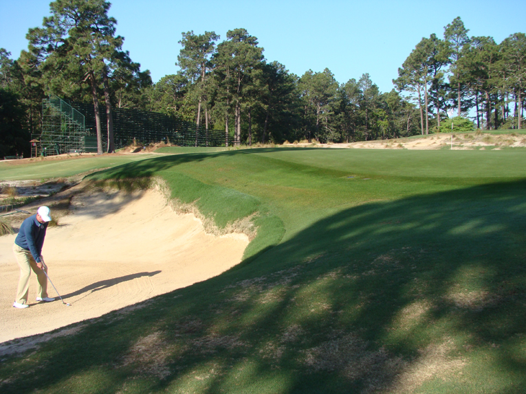 Though deep, the front left bunker affords the golfer the chance of hitting a controlled recovery shot with spin to the crowned green. His splash shot needs to carry a good thirteen paces on the putting surface or the green contours repel the ball sending it back into the very same bunker. The horror of a ball returning to one’s feet makes No.2 such a nerve jangling course to play in a 72 stroke event.