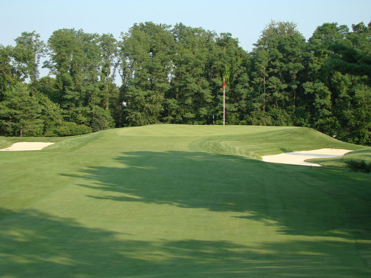 Though huge, the built-up green pad rests comfortably on the ground and presents a striking target once the golfer crests the hill.