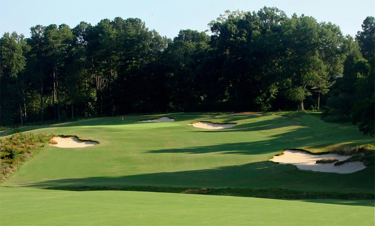 An inordinate amount of time was spent by Coore & Crenshaw perfecting the short right bunker. Given that it serves as the introduction to the course, Coore was insistent that its scale and presence command attention. Also worth noting is the appropriately colored sand which originates in the not too distant Yadkin River. Ultra-white sand would not have suited the property.