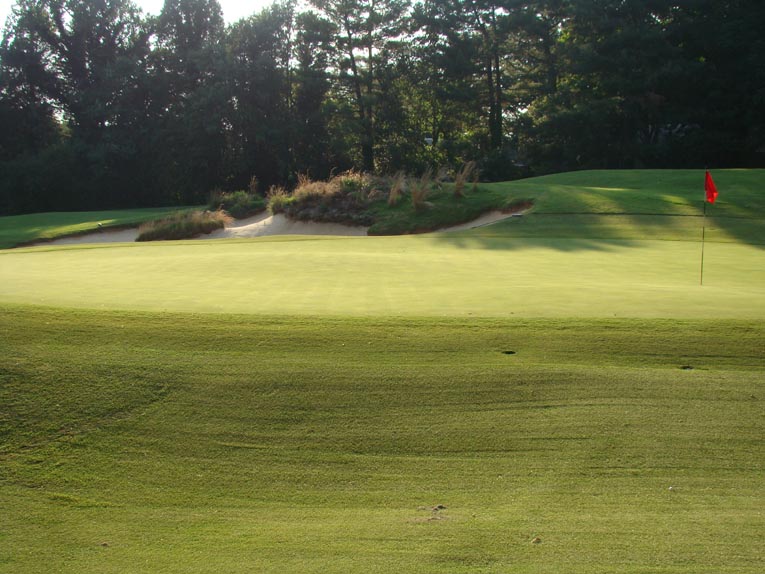 By 2000, the fifth green had morphed from subtle rolls to distinct tiers, a most un-Maxwell feature. Dave Axland worked and worked - and worked - to restore Maxwell's puffs on the putting surface with great success, as seen above in this view from the right side.