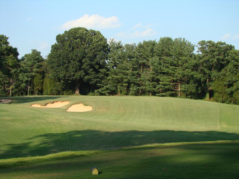 The three staggered bunkers beautifully draw the golfer's eye down the memorable fifth.