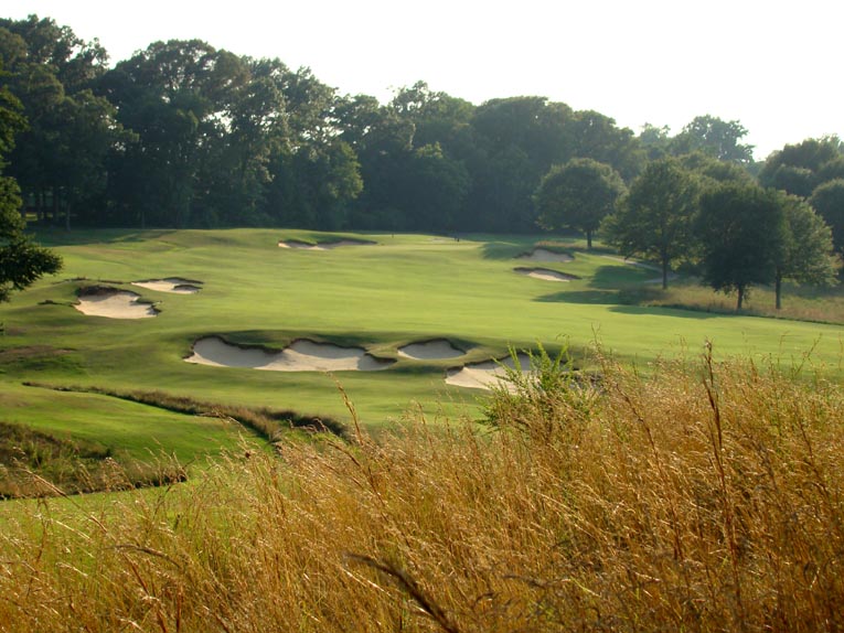 Short grass and width provide options but the hole still demands exact ball striking. The ideal progression is up the high left side of the fairway where the good golfer carries the bunkers long left to shorten the approach. Balls hit center or right of center are shunted further right by the terrain, progressively worsening the approach angle.