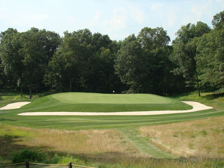 The Short hole restored to its former glory. The pronounced indentation in the middle of the green can be discerned from the tee and is the source of many a three-putt bogey.