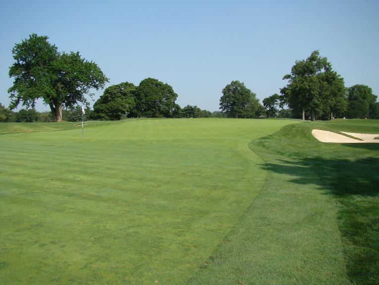 The first green starts at grade with the fairway before rising nearly six feet toward the back. Yet, it steps up so slowly, so gracefully that the first time golfer is frequently deceived by the green's wicked qualities.