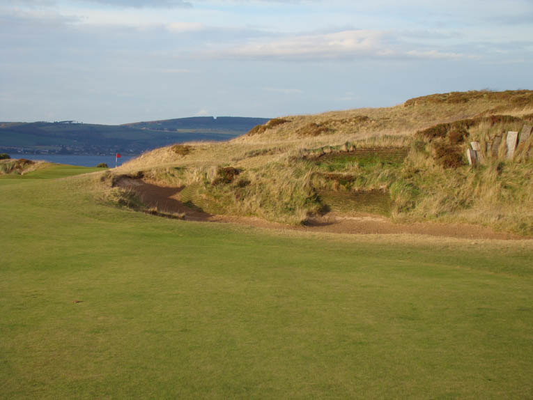 An approach shot played from the right must carry the fierce embankment 80 yards short of the green. Meanwhile, approach shots played from the left ...